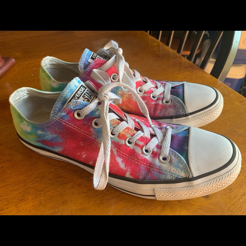 Tie-dyed Converse All-Star sneakers.